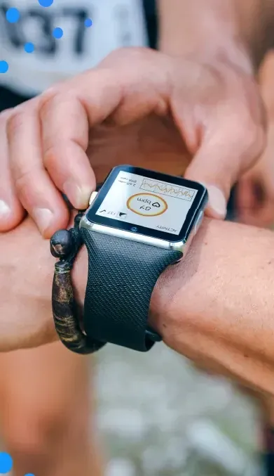 Runner checking a sports watch before a race